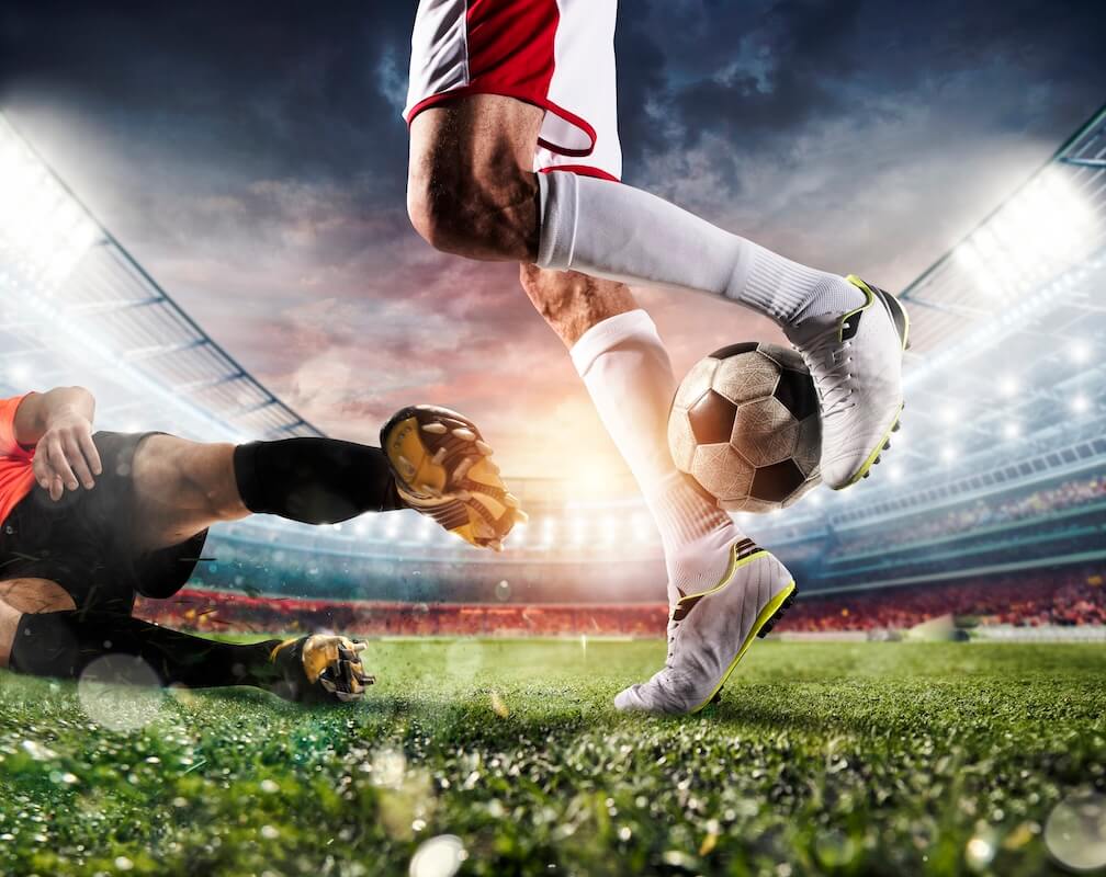Half Time Full Time Betting Guide A shot of a a footballer attempting a rainbow flick over another player trailing legs, made more interesting if you have placed a HT/FT bet!